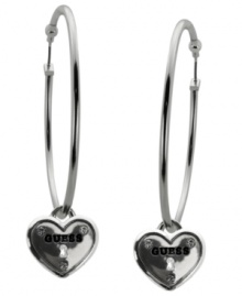 Traditional hoops receive the classic GUESS treatment. A large hoop setting feature petite heart lock charms adorned with the signature logo. Set in silver tone mixed metal with sparkling crystal accents. Approximate diameter: 2 inches.