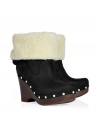 Show off your impeccable style while maintaining warmth and comfort in these wedge clogs with a cozy shearling cuff from UGG Australia - Round toe, platform, wooden wedge heel, stud-detailed trim, contrasting shearling cuff, adjustable back with D-ring buckle - Pair with skinny jeans, an oversized cashmere sweater, and a down jacket or wool cape