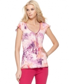 Brightened by a botanically inspired print, this Calvin Klein Jeans top is full of feminine touches, from the flutter sleeves to the graceful tie at the neck. A hint of smocking below the bust ensures a flattering fit. (Clearance) Brightened by a botanically inspired print, this Calvin Klein Jeans top is full of feminine touches, from the flutter sleeves to the graceful tie at the neck. A hint of smocking below the bust ensures a flattering fit. (Clearance)