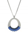 Strikingly shaped. A unique oval pendant serves as a chic setting for brilliant blue baguette crystals on this Kenneth Cole New York necklace. Crafted in hematite tone mixed metal. Approximate length: 30 inches + 3-inch extender. Approximate drop: 2-7/10 inches.