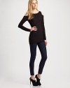 Skin-baring cut-outs at the shoulders lend subtle allure to this ultra-modern stretch knit.Scoopneck Long sleeves Pullover style About 28 from shoulder to hem 94% rayon/6% spandex Dry clean Made in USA