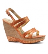What summer wardrobe couldn't use a little spice? Find yours in the bold, metallic snake-print of the Oldeander wedge sandals by Isola.