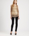 Rock the bold-shoulder trend in this sequined, silk-rich blouse with a lavish leopard print, split shoulders and airy silhouette. RoundneckSplit three-quarter sleevesLonger length hits below the hipsBody: SilkTrim: 62% viscose/35% polyethylene/3% elastaneDry cleanMade in USA of imported fabricModel shown is 5'10 (177cm) wearing US size Small.