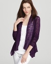 A sheer purple fabric takes to an elegant waterfall hem for a refined version of the classic Eileen Fisher cardigan.