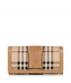 With its characteristic check and modern metallic piping, Burberry Londons continental wallet is an iconic way to keep your most valuable essentials organized - Haymarket check coated canvas, trench suede panel, matching leather trim, flap with snap closure, back slot pocket, multiple credit card slots inside, zippered coin purse - Carry alone for running quick errands, or stash away in a sophisticated leather tote