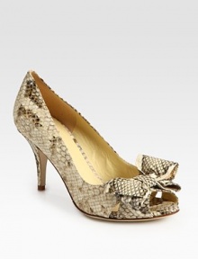 Snake-embossed leather confection has a kitten heel, peep toe and darling bow adornment. Self-covered heel, 4 (100mm)Snake-print leather upperLeather lining and solePadded insoleImportedOUR FIT MODEL RECOMMENDS ordering true size