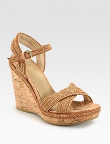 Braided leather straps rest on an earthy cork wedge and platform, concluding with an adjustable slingback. Cork wedge, 4½ (115mm)Cork platform, 1 (25mm)Compares to a 3½ heel (90mm)Cork and leather upperLeather liningRubber solePadded insoleImportedOUR FIT MODEL RECOMMENDS ordering true size. 