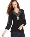 Get a breezy, glamorous look with Ellen Tracy's semi-sheer peasant top, complete with sequins at the chest and neckline.