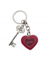 GUESS knows the key to your heart: an adorable enamel keychain locket with Je t'adore engraved on one side and a small picture frame on the other.