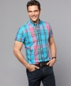 In a fresh color palette and modern slim fit, this plaid shirt from Tommy Hilfiger will be a stylish staple.