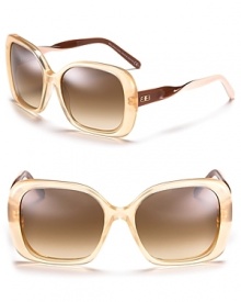 Chic oversized sunglasses with signature logo detail at temples.