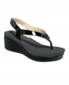 Super high and super shiny. Calvin Klein's Wyomi wedge sandals have the thickest rubbber sole ever.