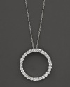 From the Tiny Treasures collection, a large, diamond circle necklace; with signature ruby accent. Designed by Roberto Coin.