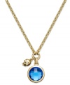 Walk on the edge with this Juicy Couture charm necklace. A circular glass stone in shimmering blue hues is paired with a skull charm for added toughness. Crafted in gold tone mixed metal. Approximate length: 16 inches. Approximate drop: 1-1/2 inches.