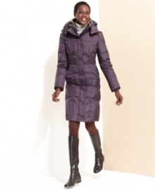 Bundle up in style with London Fog's quilted puffer. Luxurious faux fur lines the hood and collar of this cozy coat.