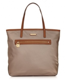 MICHAEL Michael Kors gives a timeless silhouette a luxe upgrade with 18K gold signature hardware and rich leather trim. Crafted in durable nylon with a soft sheen finish, this carryall is pure perfection. MICHAEL Michael Kors gives a timeless silhouette a luxe upgrade with 18K gold signature hardware and rich leather trim. Crafted in durable nylon with a soft sheen finish, this carryall is pure perfection.