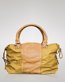 Liebeskind's nylon and leather proves daily jaunts or weekend getaways deserve a luxe look. Sized for essentials and your stylish extras, this mixed media bag is a must-have. Liebeskind's nylon and leather proves daily jaunts or weekend getaways deserve a luxe look. Sized for essentials and your stylish extras, this mixed media bag is a must-have.