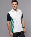 Go bold. Cool color blocking gives this Tommy Hilfiger polo shirt standout style.