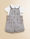 Preppy heritage style is adorably interpreted with an ultra-comfortable cotton jersey set that pairs a striped seersucker overall with a short-sleeved solid bodysuit. Overall Button-front shoulder strapsSleevelessSide buttons Bodysuit Peter Pan collarShort sleevesBack snapsBottom snapsCottonMachine washImported Please note: Number of buttons/snaps may vary depending on size ordered. Additional InformationKid's Apparel Size Guide 