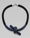 A statement design with a glossy enamel covered knotted rope. RopeEnamelLength, about 16Metal hook clasp closureMade in USA