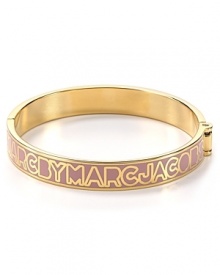 MARC BY MARC JACOBS lends it's signature stamp to this 12-karat gold plated bangle. Slip this piece on your wrist to give your bracelet stack a branded touch. MARC BY MARC JACOBS lends it's signature stamp to this 12-karat gold plated bangle. Slip this piece on your wrist to give your bracelet stack a branded touch.
