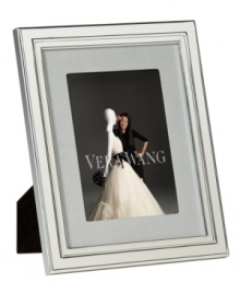 Always look elegant within the Chime picture frame from Vera Wang. Luxe silver plate with clean lines and beveled edges makes a lasting impression all its own. Interior rim features classic ribbed detail. Always look elegant within the Chime picture frame from Vera Wang. Luxe silver plate with clean lines and beveled edges makes a lasting impression all its own. Interior rim features classic ribbed detail.