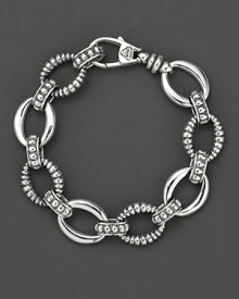 Smooth and fluted link sterling silver bracelet, with a logo lobster clasp. Designed by Lagos. Smooth and fluted link sterling silver bracelet, with a logo lobster clasp. Designed by Lagos.