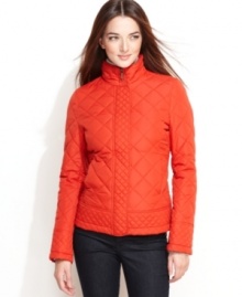 A new take on a classic: Tommy Hilfiger updates a quilted barn jacket with faux-leather buckled tabs at the waist for a touch of equestrian-inspired chic. A new take on a classic: Tommy Hilfiger updates a quilted barn jacket with faux-leather buckled tabs at the waist for a touch of equestrian-inspired chic.