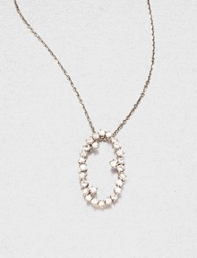 Sparkling white sapphires set in 14k white gold with a open oval design on a delicate link chain. White sapphire14k white goldLength, about 16Pendant size, about .6 Spring ring closureMade in USA Sparkling white sapphires set in 14k white gold with a open oval design on a delicate link chain. White sapphire14k white goldLength, about 16Pendant size, about .6 Spring ring closureMade in USA