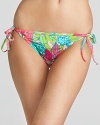 Lilly Pulitzer's petal-printed bikini's is a fresh floral statement. In a flattering cut, this string tie bottom is prep chic with flat sandals and a breezy cotton tunic.