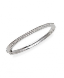 Perfect for day or evening, pair this chic Swarovski style with other stackable bangles for a trendy layered look. Bangle features a clear crystal-coated front with a hinged design. Crafted in silver tone mixed metal. Approximate diameter: 2-1/2 inches.