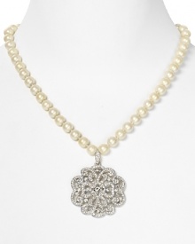 Give into glamour with Carolee's sparkling pearl necklace. With an ornate crystal pendant, this strand vows to wow.