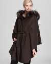 Wrap up against the chill with this sumptuous Dawn Levy cape finished with a Silver fox fur trimmed hood.