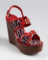 Overflowing with unique details, the Tory Burch Florian wedges offer modern Americana. In patriotic red, white and blue, this standout shoe isn't afraid to show off its fashionable allegiances.