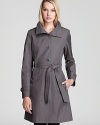 Forgoing belt loops for a woven design, this unique Via Spiga trench coat is a modern choice for the season. Featuring marbled buttons with silver hardware, military-inspired epaulets and a stand collar, it moves from day to evening in of-the-moment style.