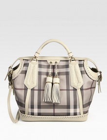 The iconic Burberry check defines this roomy shape of smooth PVC, finished with leather trim and super-chic tassels. Double leather top handles, 3¼ dropAdjustable detachable leather shoulder strap, 17-20½ dropTop zip closureOne inside zip pocketTwo inside open pocketsCotton lining13W X 12¾H X 7¾DMade in Italy The iconic Burberry check defines this roomy shape of smooth PVC, finished with leather trim and super-chic tassels. Double leather top handles, 3¼ dropAdjustable detachable leather shoulder strap, 17-20½ dropTop zip closureOne inside zip pocketTwo inside open pocketsCotton lining13W X 12¾H X 7¾DMade in Italy