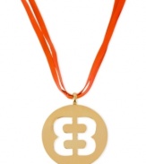 Flaunt your love for Betsey Johnson with this vibrant pendant necklace. A cut-out emblem is displayed on a circular pendant. Strands made in fuchsia faux-leather. Crafted in antique gold tone mixed metal. Approximate length: 20 inches + 3-inch extender. Approximate drop: 2-1/2 inches.