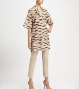 Chic tunic style blouse in cotton voile with an abstract animal print.V necklineCrossover lapelsDropped shoulderWide elbow-length sleevesConcealed button front closureVented sidesAbout 35 from shoulder to hemCottonDry cleanImported of Italian fabricModel shown is 5'11 (180cm) wearing US size 4.OUR FIT MODEL RECOMMENDS ordering true size. 