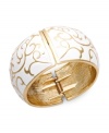 Stack your wrists with bold, vibrant styles. Charter Club's fancy bangle bracelet features a scrolling pattern in white enamel. Crafted in gold tone mixed metal. Secures with a hinge clasp. Approximate diameter: 2-1/2 inches.