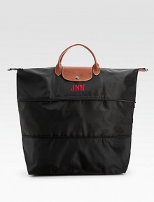 Versatile and stylish, this expandable bag with tonal zippers on the body includes a detachable shoulder strap and soft leather trim.Double handles, 4¼ drop Detachable shoulder strap, 13½ drop Top zipper and snap flap closures Inside open pocket Fully lined Nylon canvas; leather trim 17¾W X 20½H X 9D ImportedFOR PERSONALIZATIONSelect a color and quantity Versatile and stylish, this expandable bag with tonal zippers on the body includes a detachable shoulder strap and soft leather trim.Double handles, 4¼ drop Detachable shoulder strap, 13½ drop Top zipper and snap flap closures Inside open pocket Fully lined Nylon canvas; leather trim 17¾W X 20½H X 9D ImportedFOR PERSONALIZATIONSelect a color and quantity