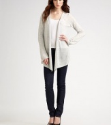 Ultra-soft cashmere shapes the body with and angular hem and bell sleeves. Dry clean or hand wash Imported