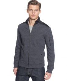 Get on track with this upgraded zip front sweatshirt by Calvin Klein. Get on track with this upgraded zip front sweatshirt by Calvin Klein.