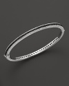 Black sapphires stud a sterling silver bangle from Judith Ripka.