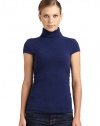 THE LOOKLuxe 2-ply cashmere from expertly maintained inner Mongolian cashmere goatsFeatures long, fine, smooth fibers top-dyed for maximum color saturationTurtleneck with ruched back detailRibbed cuff cap sleevesRuched sides Ribbed hemTHE FITAbout 23 from shoulder to hemTHE MATERIALCashmereCARE & ORIGINDry cleanImportedModel shown is 5'10 (177cm) wearing US size Small. 