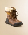 The perfect cold weather style will keep their feet warm and dry all season long. Lace front Embossed UGG logo Sheepskin sock liner Flexible sole with superior traction Removable sheepskin insole Imported