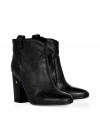 Add a punch of Parisian cool into your everyday favorite footwear collection with Laurence Dacades matte black leather ankle boots, detailed with a blocky heel and pull-tabs for that effortless-chic finish - Rounded toe, covered leather heel - Pair with tights and cashmere dresses for work, or with super slim skinnies and chunky knits for laid-back weekend