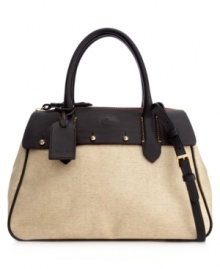A refined design ideal for the office and beyond. This chic style from Dooney & Bourke features sleek contrast trim, goldtone hardware and the iconic emblem at front. A refined design ideal for the office and beyond. This chic style from Dooney & Bourke features sleek contrast trim, goldtone hardware and the iconic emblem at front.