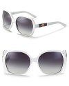 Interlocking G logos at temples elevate these oversize Gucci shades to covetable statement accessories. Bold white frames channel style-savvy confidence.