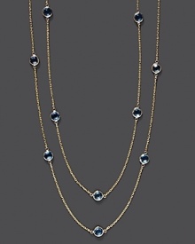 Round checkerboard blue topaz stations gleam on a long, loopable 14K yellow gold chain.