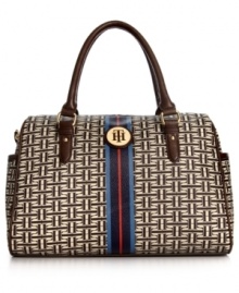 Live la vida logo with this signature print purse from Tommy Hilfiger. The classic satchel design it adorned with golden hardware, monogram plaque and preppy center stripe, while the interior is outfitted with plenty of pockets to keep essentials safe. Live la vida logo with this signature print purse from Tommy Hilfiger. The classic satchel design it adorned with golden hardware, monogram plaque and preppy center stripe, while the interior is outfitted with plenty of pockets to keep essentials safe.